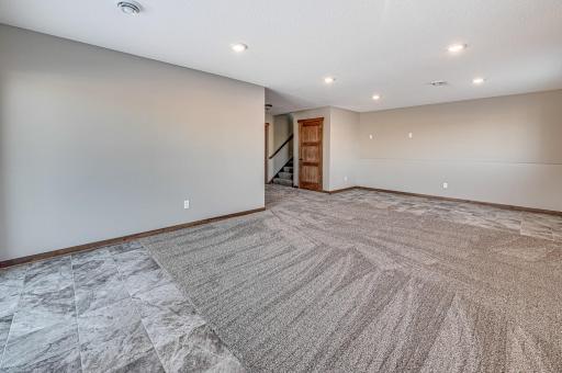 Finished lower level shown is from a previous model home. Lower-level finishing is available as an upgrade for an additional cost. Choose from a variety of colors, cabinets, trims, etc. All photos are from a similar model home.