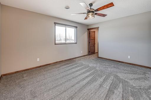 Finished lower level shown is from a previous model home. Lower-level finishing is available as an upgrade for an additional cost. Choose from a variety of colors, cabinets, trims, etc. All photos are from a similar model home.