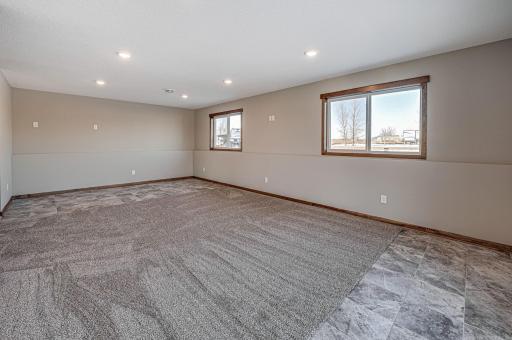 Finished lower level shown is from a previous model home. Lower-level finishing is available as an upgrade for an additional cost. Choose from a variety of colors, cabinets, trims, etc. All photos are from a similar model home.