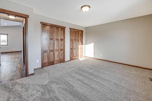Finished lower level shown is from a previous model home. Lower-level finishing is available as an upgrade for an additional cost. Choose from a variety of colors, cabinets, trims, etc. All photos are from a similar model home.