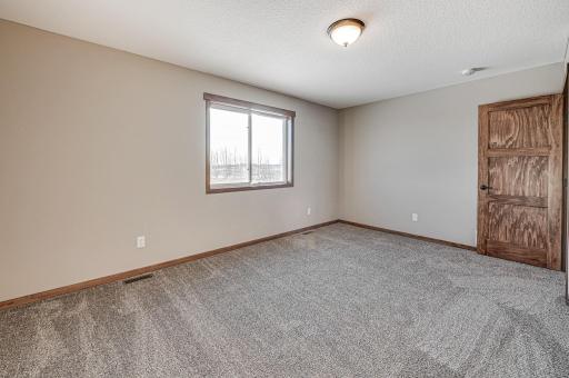 Finished lower level shown is from a previous model home. Lower-level finishing is available as an upgrade for an additional cost. Choose from a variety of colors, cabinets, trims, etc. All photos are from a similar model home.