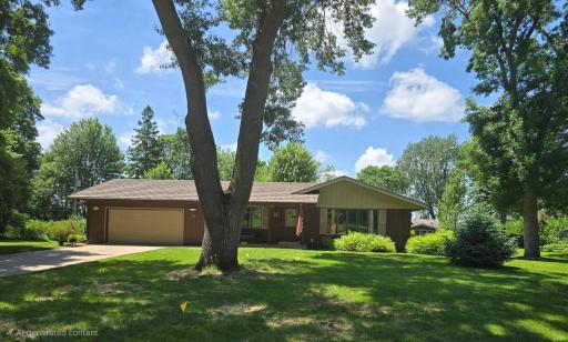 2536 13th Ave SE, St Cloud, MN with large flat lot nearly 1/2 acre, landscaped with mature trees, concrete driveway
