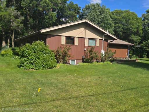 View of the North side of the home. There is a Radon Remediation system installed in the home