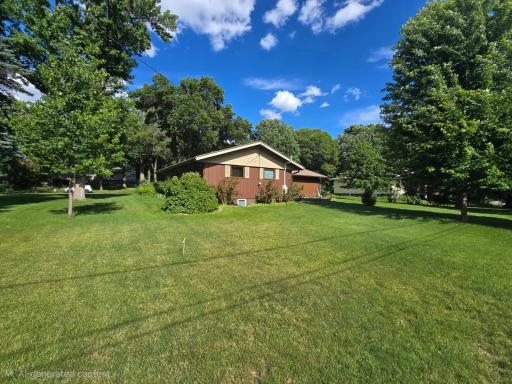 More distant view of North side of the home with .44 acres to explore and have fun on with children or friends