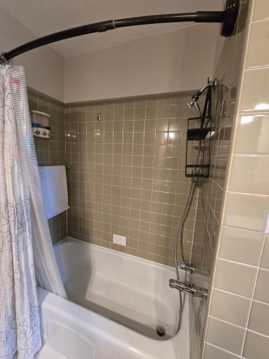 Full bath has ceramic wall tiles and ceramic floors for easy cleanup.
