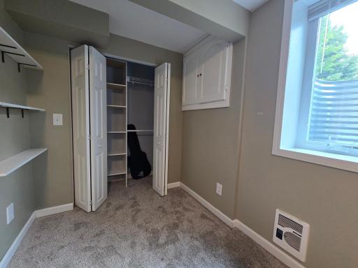 There is a recessed nook area for closet storage and extra shelves