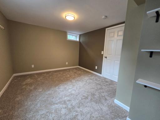 4th bedroom with carpet, shelves, and more, note all the outlets !