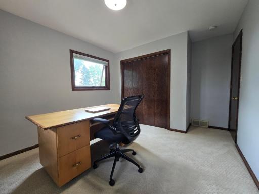 third bedroom recently used as an office with carpeted floors