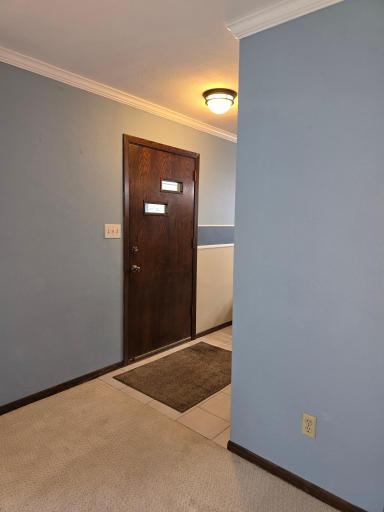 2536 carpeted living room leads to tile floor foyer