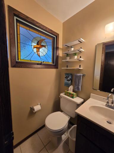 The half bath has stained glass window in both bathrooms for light and privacy, any visitors always comment on the uniqueness an beauty of the glass
