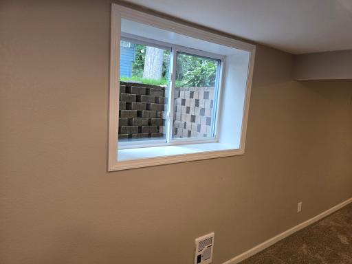 The family room has a decorative stone egress for light and safety