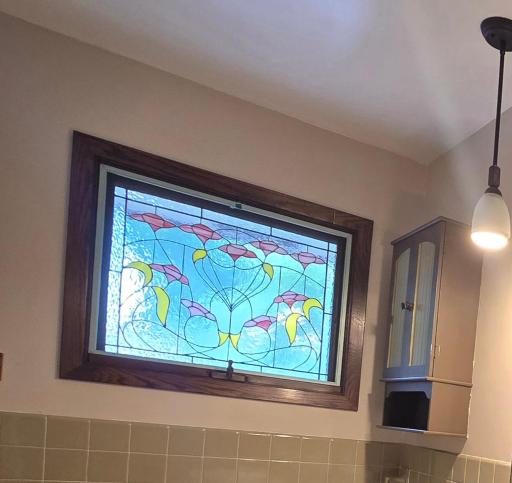 Custom made stained glass windows in each bathroom