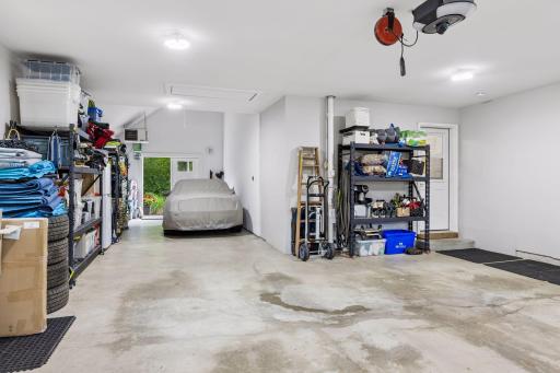 The garage is insulated and heated and was expanded to add a vaulted third stall with convenient double door access to the backyard. There is drop-down ladder access to a huge storage space above the garage and easy access over finished spaces.