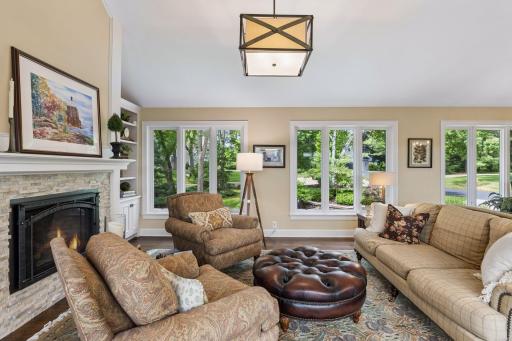 This elegant main-level living room enjoys a view of the beautifully landscaped front yard.