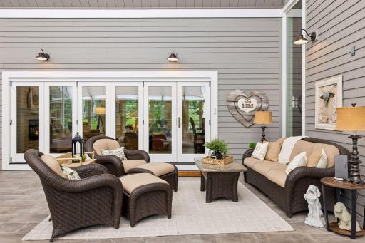 There is plenty of room to create a comfortable conversation or reading area in the comfort of the screened in porch.