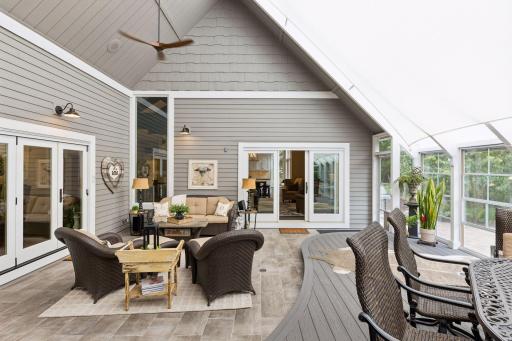 The 2016 renovation included Marvin windows and doors throughout the home including, sliders and the accordion style patio door between the porch and living room.