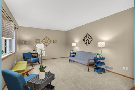 Generously sized family room offers flexible furniture placement and plenty of space for gathering and entertaining.