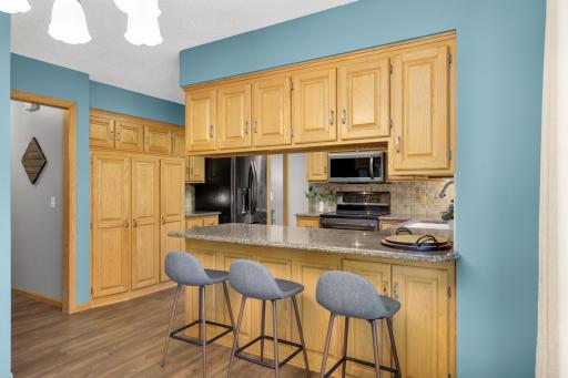 Open kitchen layout keeps the cook connected to the dining and living spaces.
