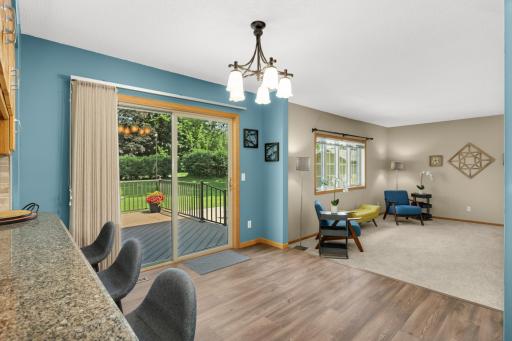 Bright, eat-in dining area with direct access to the deck and backyard, creating an effortless connection between indoor and outdoor living.