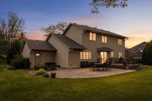 Expansive backyard patio and maintenance-free deck provide exceptional outdoor entertaining space.