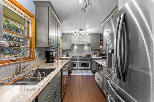 Wonderfully updated Modern kitchen featuring stainless steel appliances, generous counter space, and stylish cabinetry.