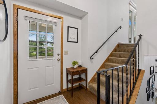 Front entry and stairs to both upper and lower level