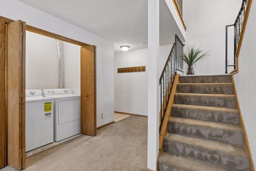 Laundry closet in lower level and foyer to garage entry