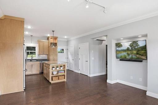 Kitchen, dinning and living room flow together. Virtually staged