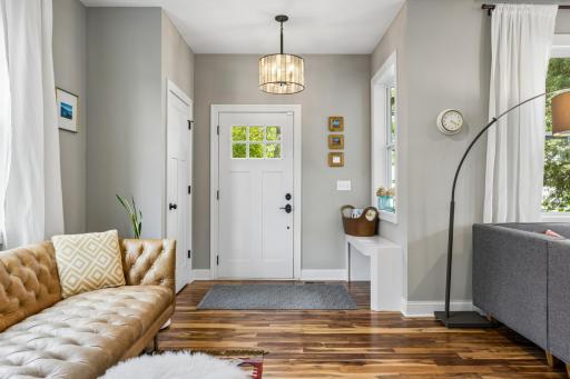 Bright and welcoming foyer provides an inviting transition into the main living spaces.