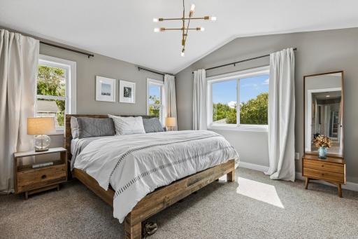 Light-filled primary suite with abundant windows and a spacious layout.