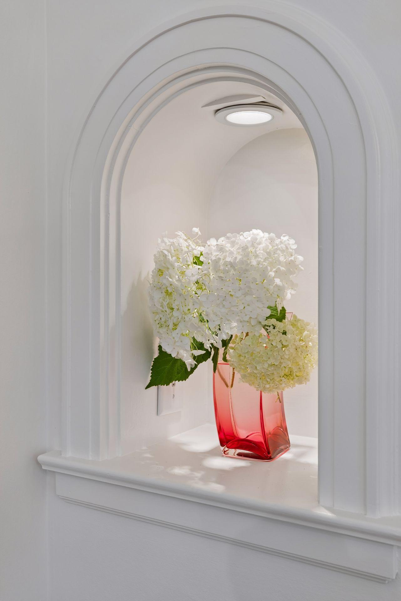 Former phone niche in formal dining room adds charm and character.