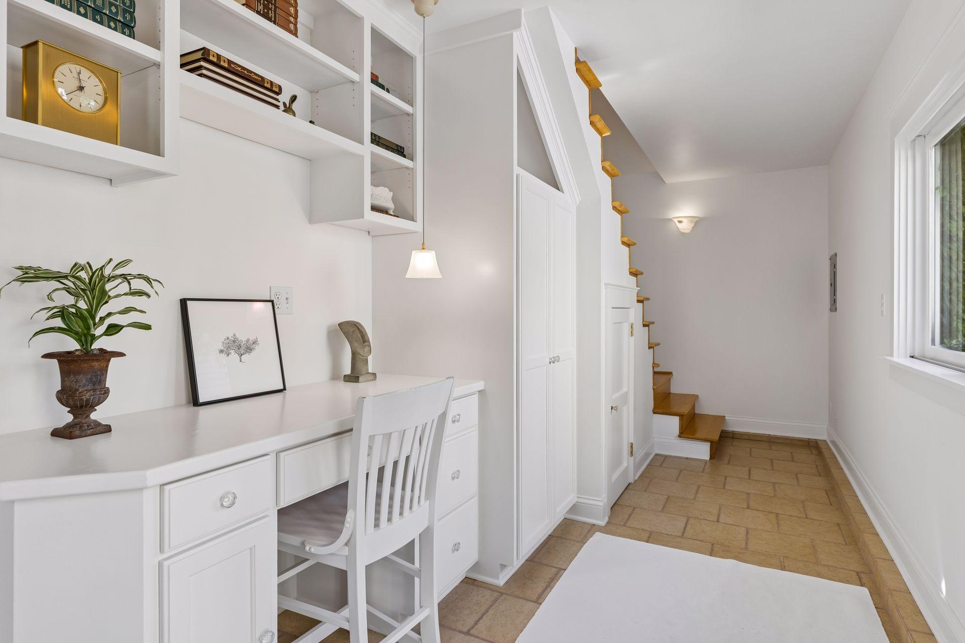 Detached garage office main level space leads to upper level flex space.