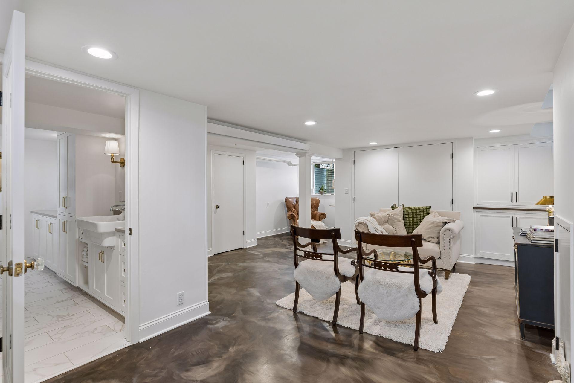 Lower level family room features unique high performance floors with epoxy finish.