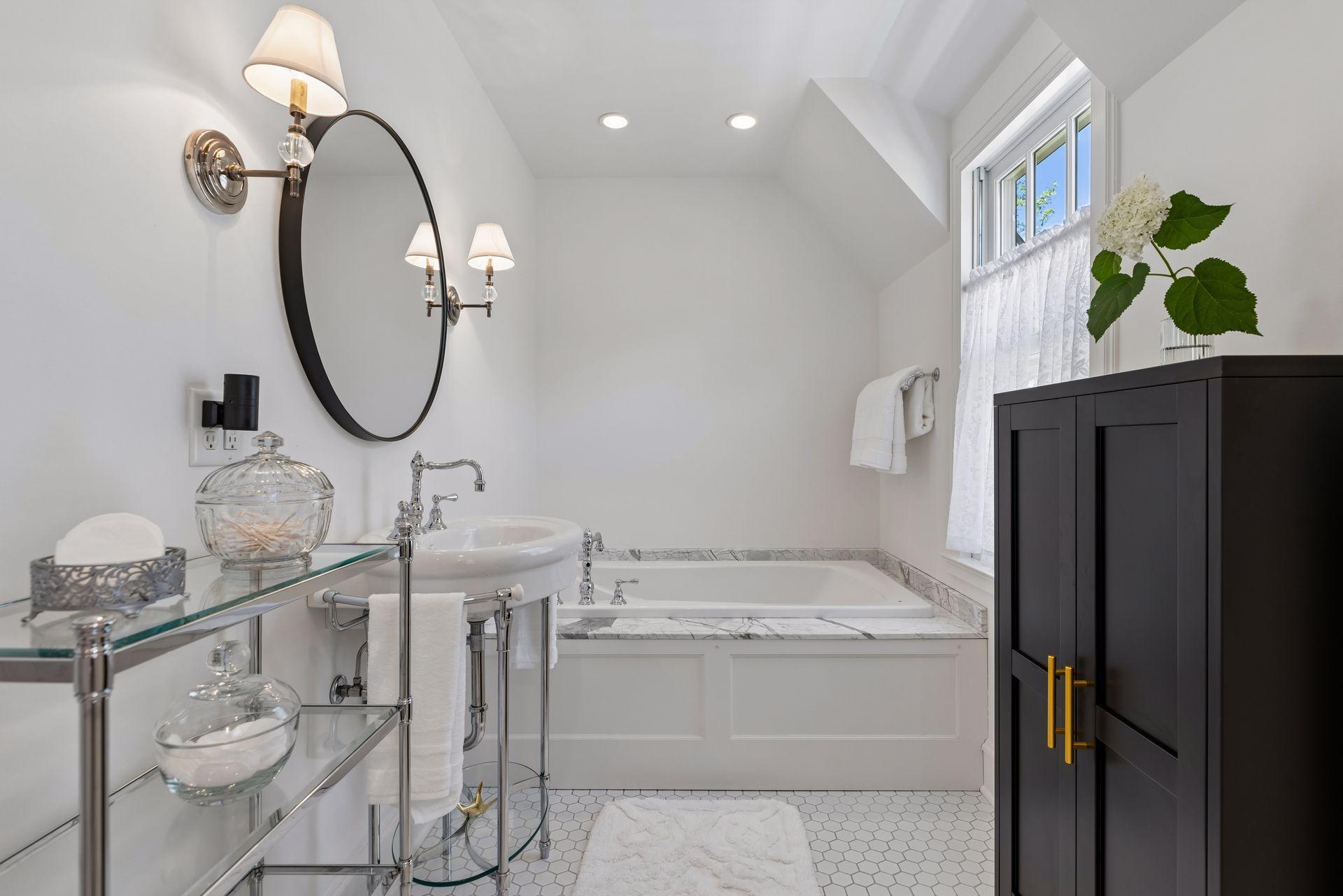 Primary full bath with separate tub and shower.