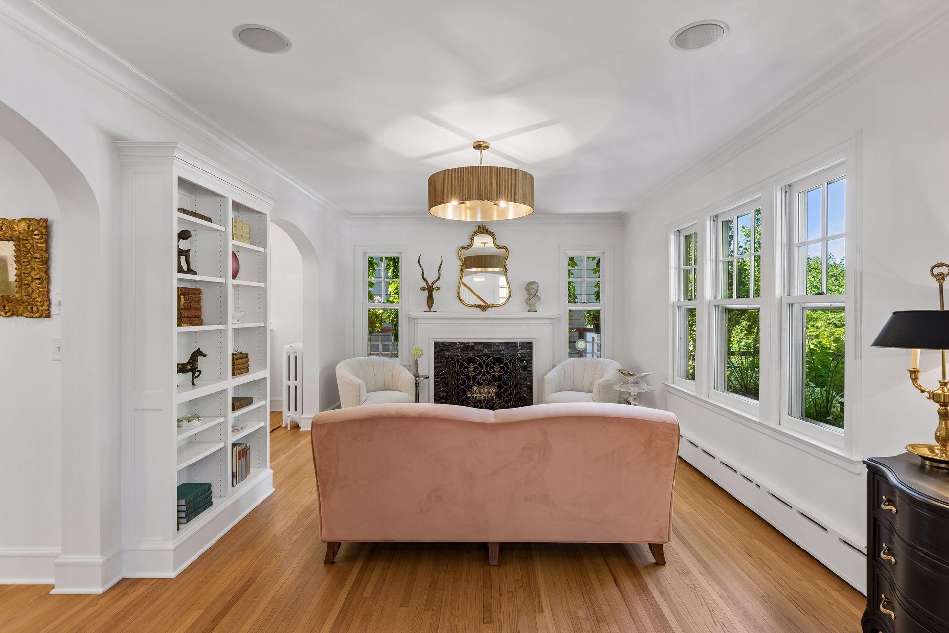 Custom bookcases enhance living room space with wood burning fireplace. Liner replaced in 2007 when addition was completed. Current owners have not used.