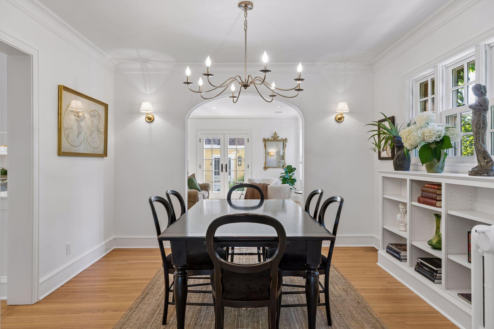 Formal dining room includes custom shelving.