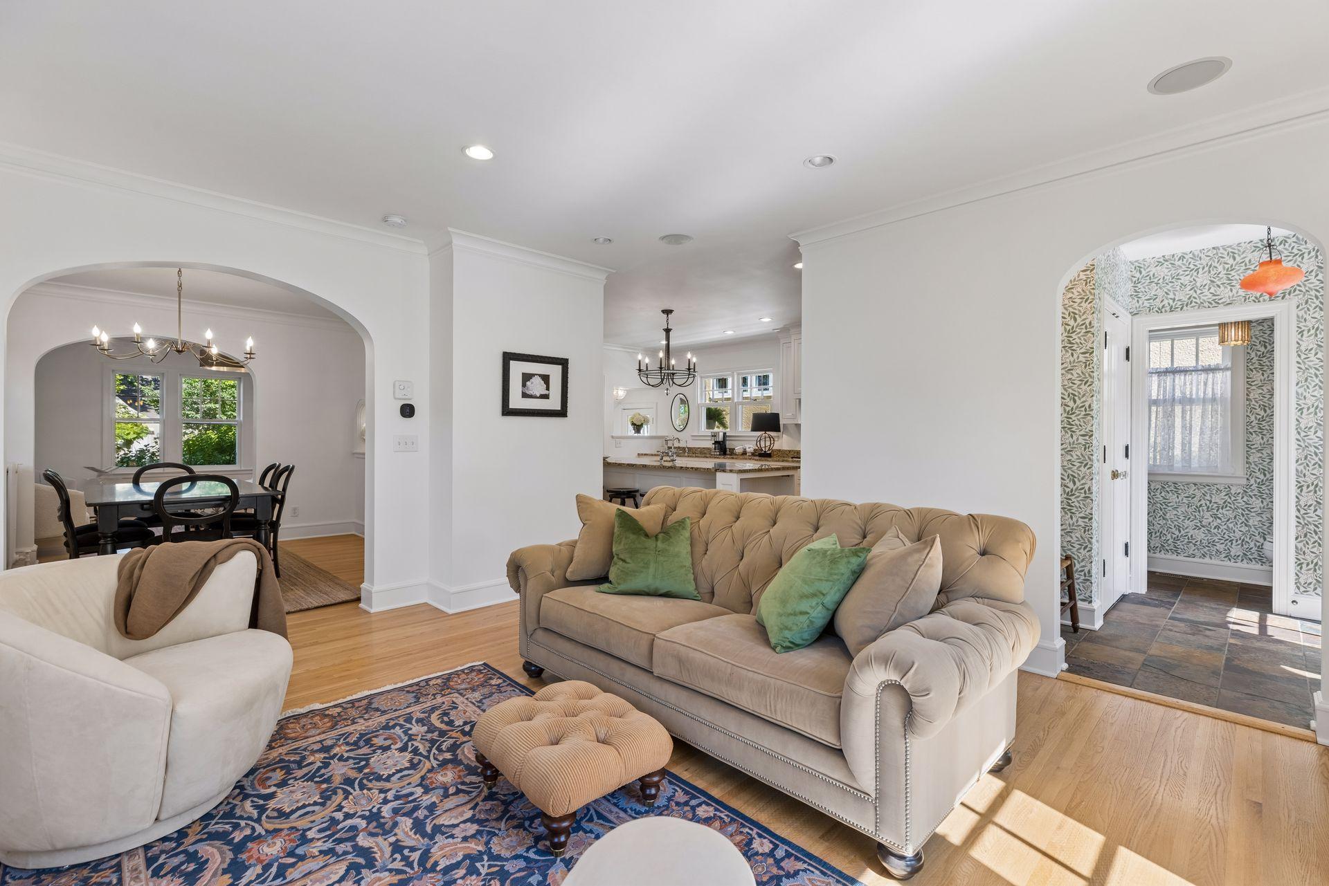 Family room leads under archway into back entry and 1/2 bath.