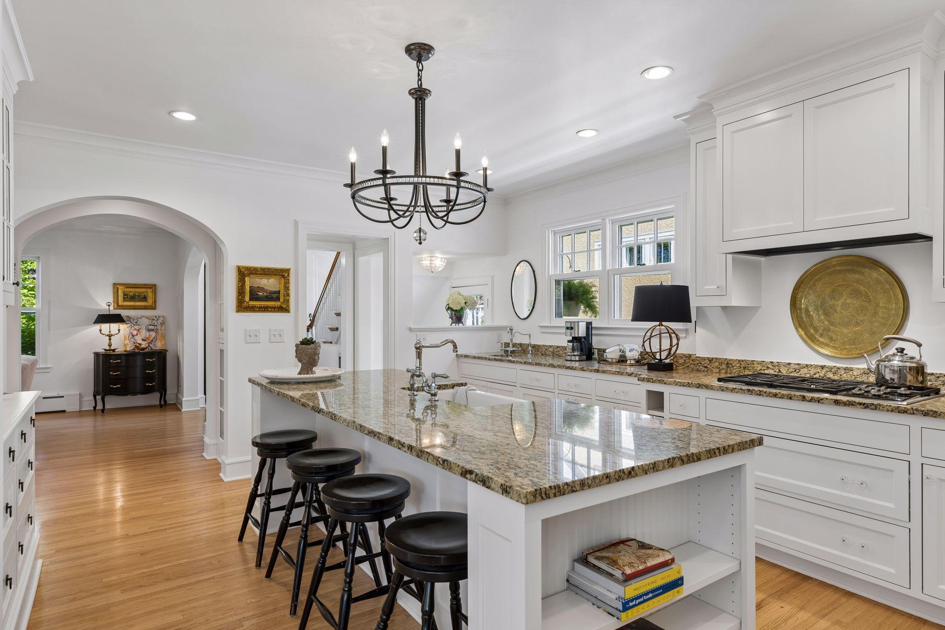 Custom built kitchen holds abundant storage and fantastic gathering space.