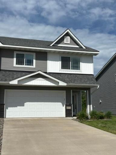 The front has great curb appeal with a concrete driveway.