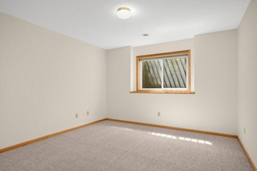 This lower level space also features an incredible storage room which could double as a hobby or workout space.