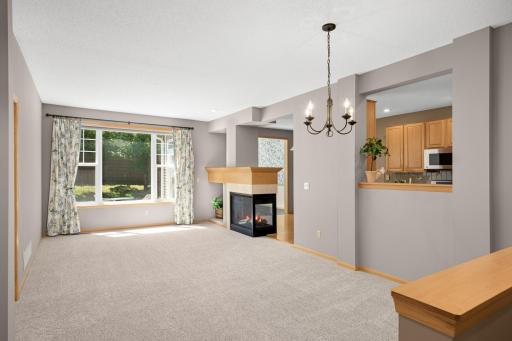 Enjoy brand new carpet, designer decor, beautiful wallpaper, and custom draperies throughout.