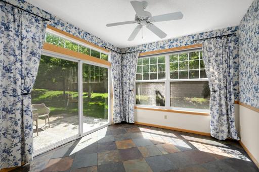 The slate floors add a beautiful texture, and the designer decor is a statement feature.