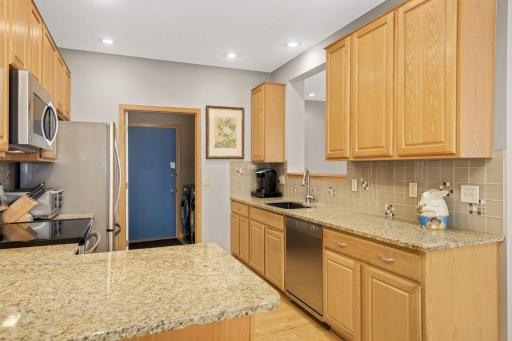 The mud room just beyond the kitchen features a newer washer and dryer and no stairs when you head out to the garage.