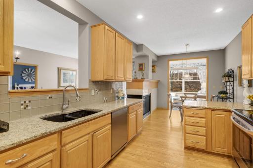 I love the peek-a-boo window above the sink overlooking the formal dining room.