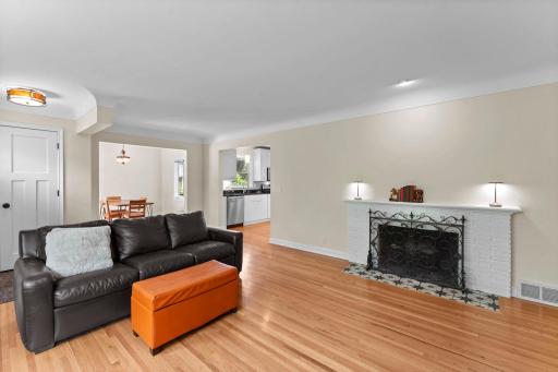 Originally there was a half wall separating the foyer from the LR which the seller removed. When you are in the home look at the hardwood floors adjoining the tile for the foyer. You cannot tell that the half wall was removed.