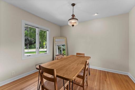 Formal dining room off the living room. The seller did not replace the windows in the dining room.