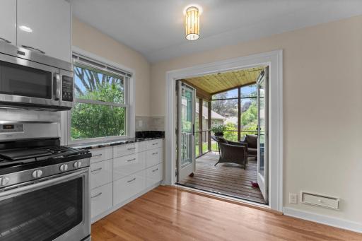 Just a glimpse of the fantastic screen porch. The French doors open all the way.