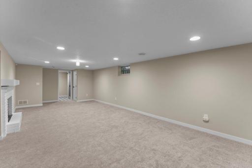 The seller removed the knotty pine on the walls, removed the popcorn ceiling and added knock down ceilings and removed the original tile flooring.