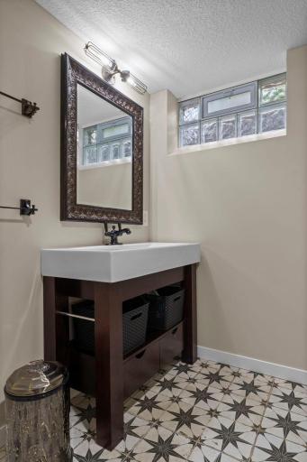 The LL 3/4 bath is roomier than it appears. You can put a cabinet in the corner by the door.
