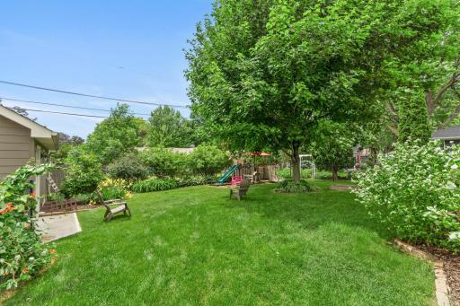 View which shows how beautifully the front and backyards are landscaped.